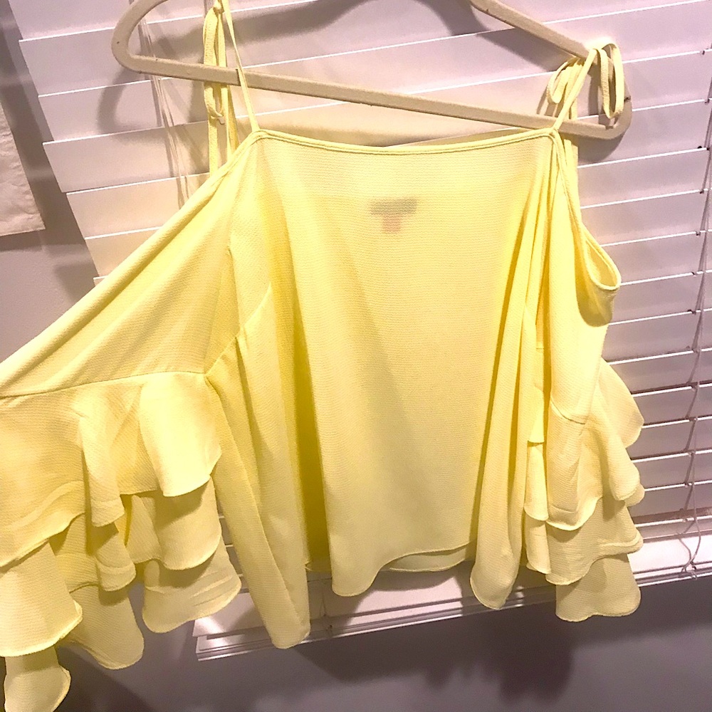 Yellow flowey shirt with ties up at time, pretty!